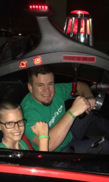 Kyle Schwarber surprised a young fan and drove with him in the Batmobile